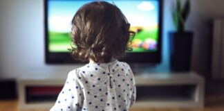 Little girl watching tv