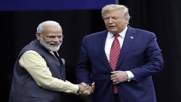 Prime Minister Narendra Modi and President Donald Trump shake hands after introductions during the "Howdi Modi"