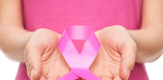 Woman with breast cancer awareness ribbon